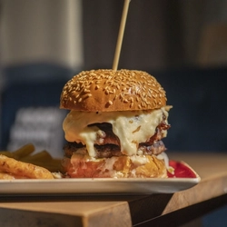 A served main Big Melt burger available at Hungry Horse venues.