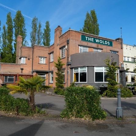 The exterior facade of The Wolds.