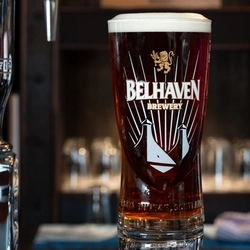 An advertising image showing a pint of Belhaven 80 Shilling sat in front of a Belhaven 80 Shilling pump tap.