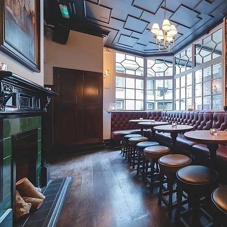 TThe interior seating area with fireplace at the Phoenix in Whitechapel.