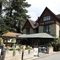 Exterior shot of the venue featuring the building and beer garden seating area and a glimpse of the car park