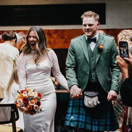 An interior shot of people celebrating a wedding taking place at the Ubiquitous Chip in Glasgow.