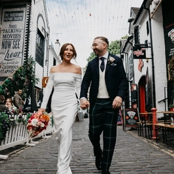 An exterior shot of the bride and groom celebrating their Wedding at the Ubiquitous Chip in Glasgow.