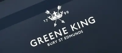 A sign with the Greene King logo printed on it.