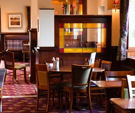 Interior dining area of a pub.