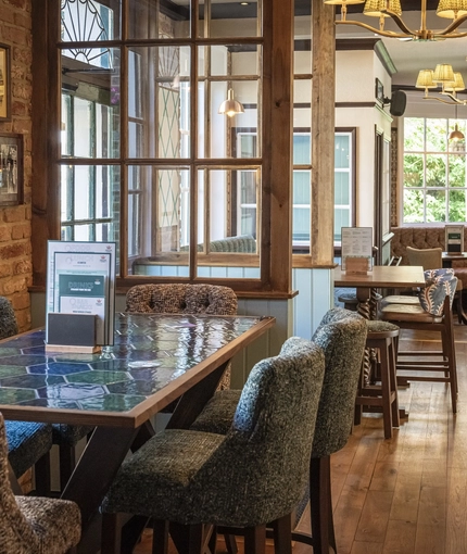 The interior restaurant seating area at The Crown & Horseshoes.