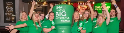 A group of Greene King staff pictured with the 'Small Change, Big Difference' Macmillan mascot.