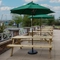 The exterior patio beer garden seating area with wooden benches at The Farmhouse Kitchen Willington.