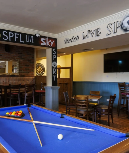 Interior shot of the pool tables and seating area