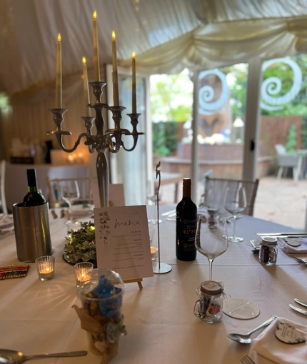 A marquee, decorated for a wedding.