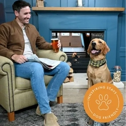 A banner promoting dog friendly stays at Greene King Inns. 