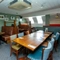 Interior dining area of a pub with a few TVs.