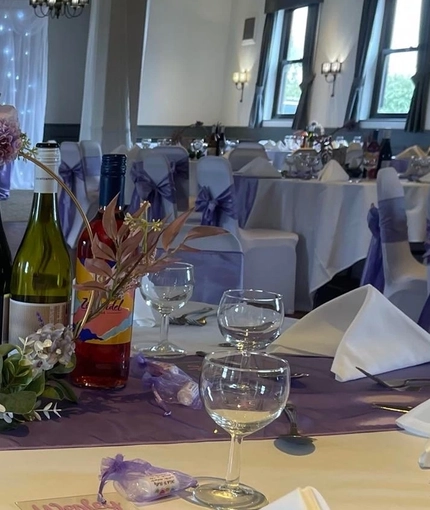 The decorated seating and dining area of the wedding event space at Windmill Farm.