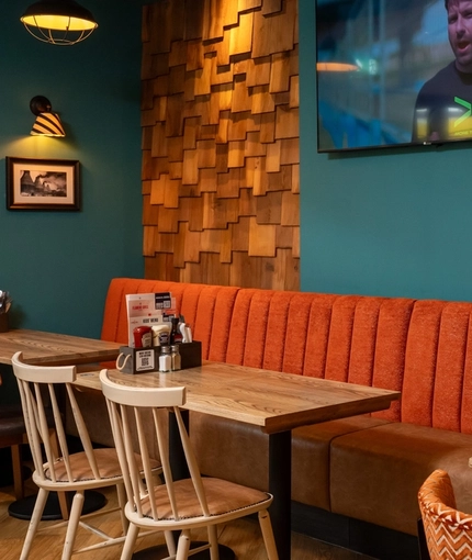 The interior restaurant and seating area with TV at the Hem Health.