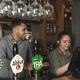 Team members serving behind the bar
