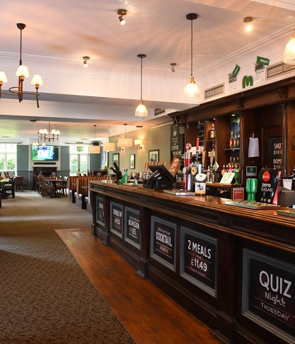 Interior bar and dining area of a pub.
