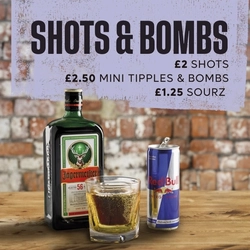 A banner promoting 'Shots And Bombs' at Flaming Grill venues.