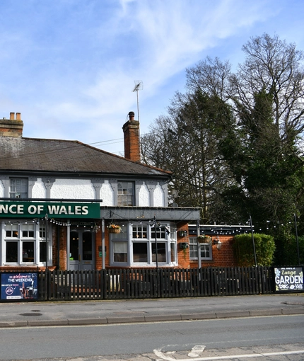 Exterior facade of a pub with a seating area