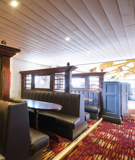 interior of the restaurant with a seating area