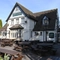 Exterior facade and beer garden of a pub with a dining area.