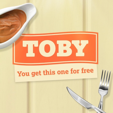 A banner showing the words "Toby" and "You get this one for free", between a jug of gravy and a crossed knife and fork.