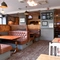 Interior dining area of a pub with a TV.
