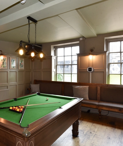 Pool table in interior games area of a pub restaurant