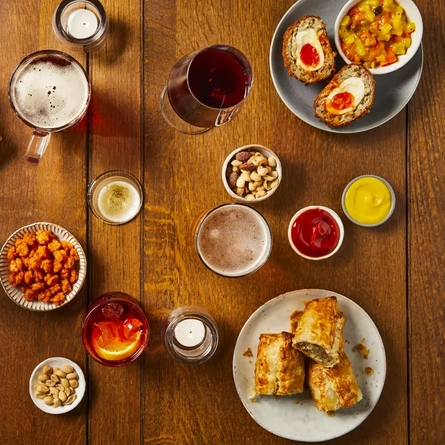 An assortment of drinks and bar snacks