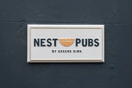 A exterior sign for 'Nest Pubs.'