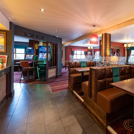The interior restaurant seating area with over 18 electronic game machines at The Hooden Horse.
