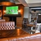 interior of the restaurant and seating area with TV