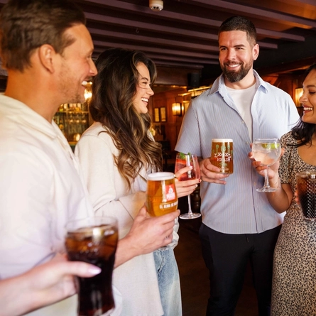 An interior image of people enjoying drinks during the Q3 Happy Hour Event.