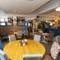 Interior dining area of a pub with a bar.
