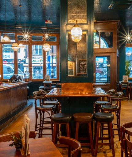 The interior bar and seating area of the Garrick Arms in Charing Cross.