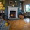 A fireplace amongst a seating area of The Bulls Head.