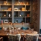 A table in front of a bookcase in the restaurant of Himley House.