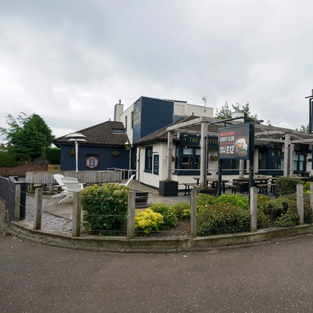 The exterior facade and beer garden seating area at The Scottish Engineer.