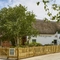 The exterior facade and beer garden seating area of The Fox & Hounds in Wimborne.