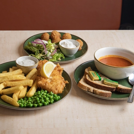 A starter of soup, a main of gammon, egg and chips and a side of breaded mushrooms served at Farmhouse Inns.