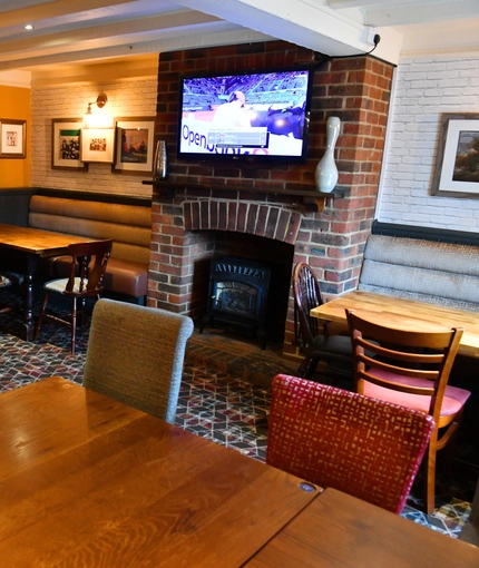 interior of the restaurant and seating area with TV