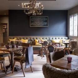 restaurant seating area with several tables set up for dining