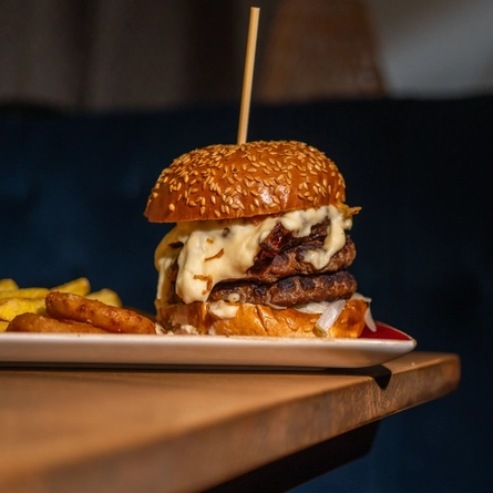 A served main Big Melt burger available at Hungry Horse venues.
