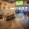 Interior dining area of a pub with a TV.