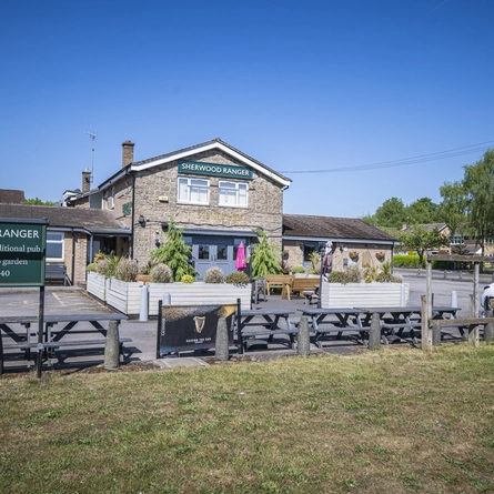 An exterior shot of the car park, facade & seating area at the Sherwood Ranger in Ravenshead.