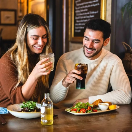 Two guests enjoying a drink together