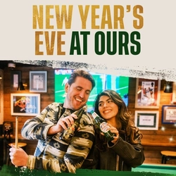 A Christmas banner promoting 'New Years Eve' at Flaming Grill venues.