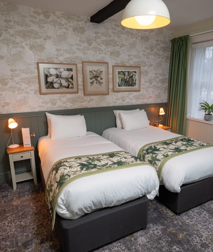 Two single beds in a twin room in The Rockingham Arms.