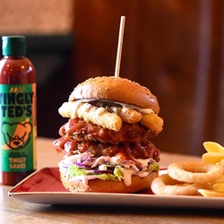 A served burger with Tingly Teds sauce at hungry Horse venues.