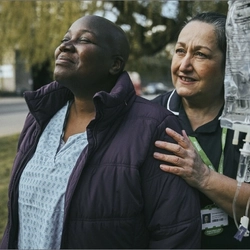 Macmillan nurse helping a patient