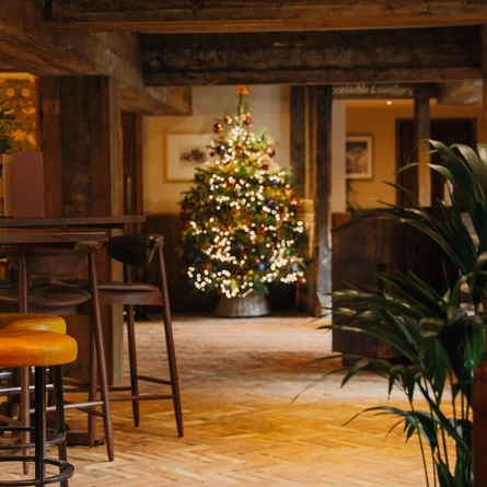 interior dining area of a pub decorated for Christmas